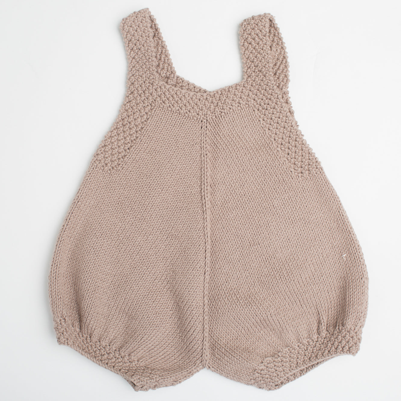 Back view of Finn Baby Romper in beige, showcasing its hand-knitted cotton yarn design with a soft and stylish look for babies.