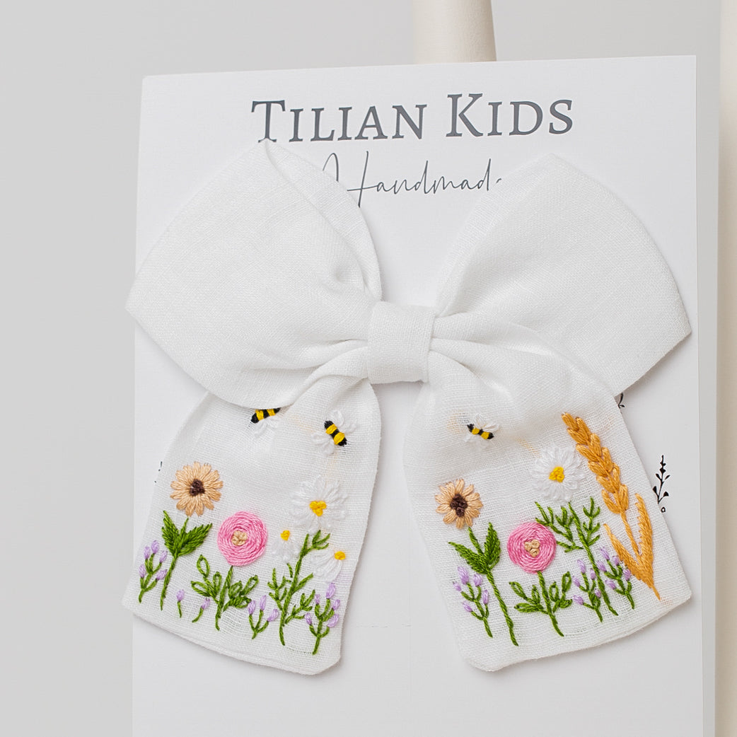 Blossom Bow - Embroidered Hair Bow handcrafted from cotton yarn, featuring floral and bee embroidery for a charming countryside-inspired look.